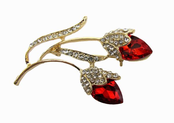 jewelry with deep red gem in a flower design