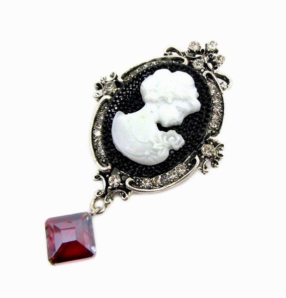 pendant with woman relief and red gemstone
