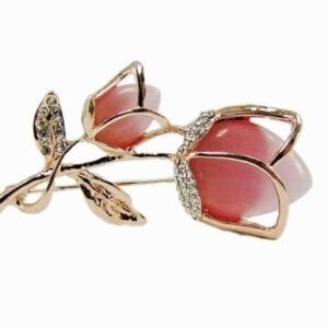 golden brooch with tulip design and pink stone inset