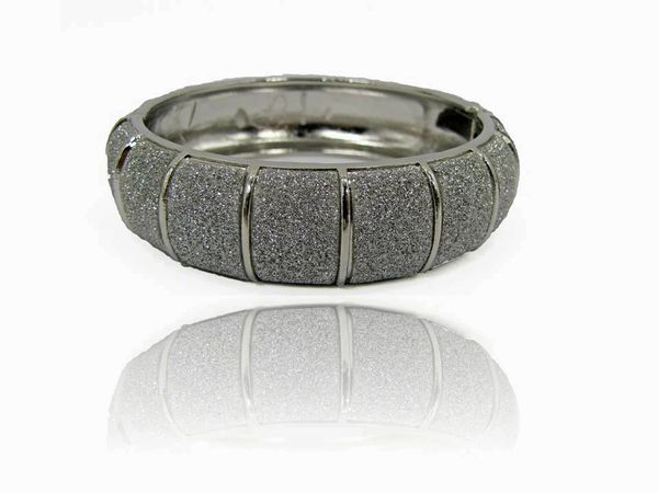 silver bangle with glittery surface