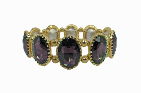 golden bracelet with oval, deep violet gems