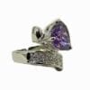ring with violet gem and intricate metal design