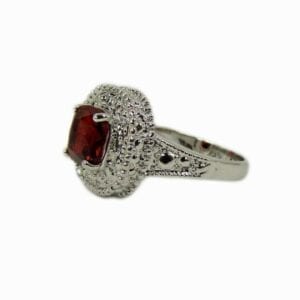 silver ring with red gem inset