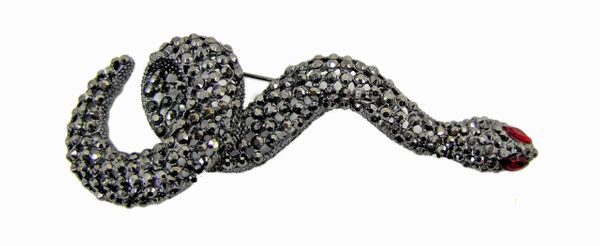 snake jewelry encrusted with black crystals