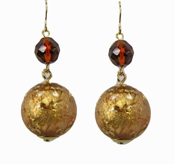 earrings with large, spherical golden pendants