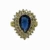 ring with teardrop sapphire gem surrounded by white crystals