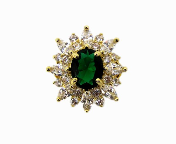 ring with emerald inset surrounded by white crystals
