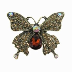 butterfly jewelry with large red gemstone