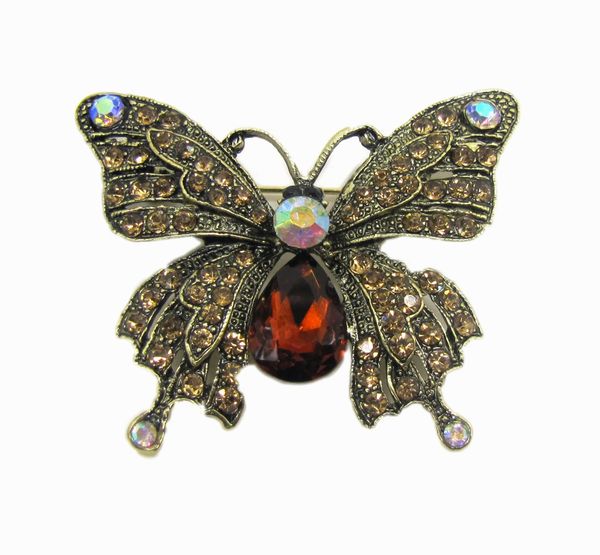 butterfly jewelry with large red gemstone