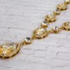 GOLD AND CLEAR CRYSTAL NECKLACE AND EARRING SET - Image 2