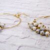 GOLD HOOP EARRINGS WITH SMALL WHITE DANGLING BEADS - Image 3