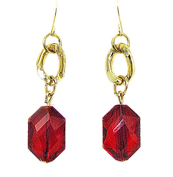 golden earrings with garnet gemstones