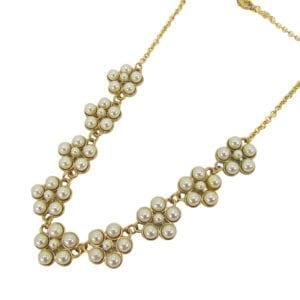 gold necklace with pearls arranged like flowers