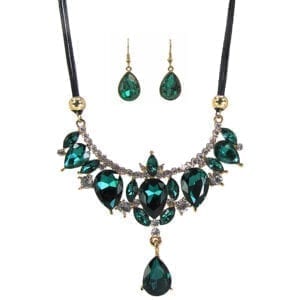 necklace and earrings with emerald gems in an elaborate design