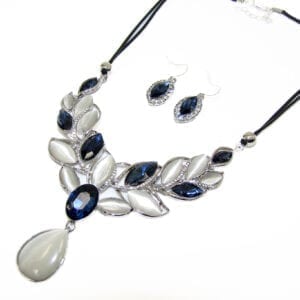necklace and earrings with sapphires and pearls arranged in a vine pattern