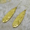LONG METAL TEARDROP SHAPE EARRINGS IN A BURNISHED GOLD FINISH - Image 2