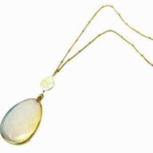 golden necklace with large white stone pendant