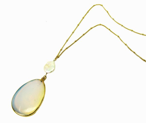 golden necklace with large white stone pendant