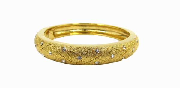 golden bracelet with white crystal studs