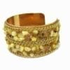 golden bracelet with pointy yellow gemstones