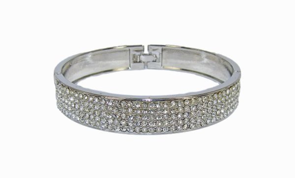 silver bangle with rows of diamond inlays