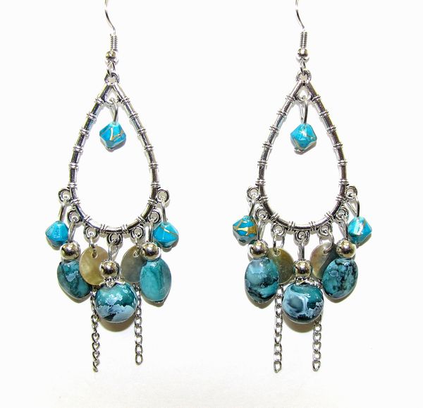 earring with teardrop-shaped wire and blue gem attachments
