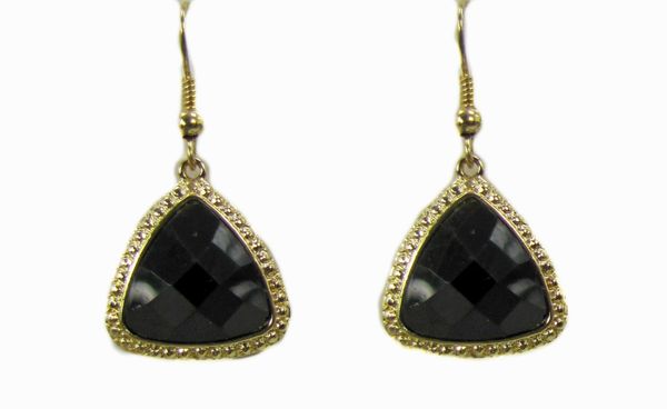 earring with large, black, triangular gems