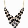 geometric necklace with dark teardrop gemstones
