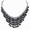 layered necklace with dark circular crystals
