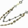 layered necklace with silver beads and olive green stones