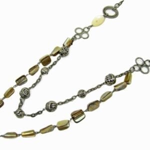 layered necklace with silver beads and olive green stones
