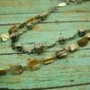 layered necklace with metal balls and banded beads