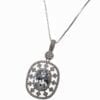 oval pendant with dark stone inset