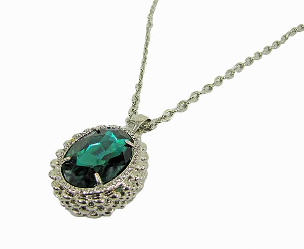 circular necklace pendant with emerald inset