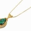 golden necklace pendant with emerald inset