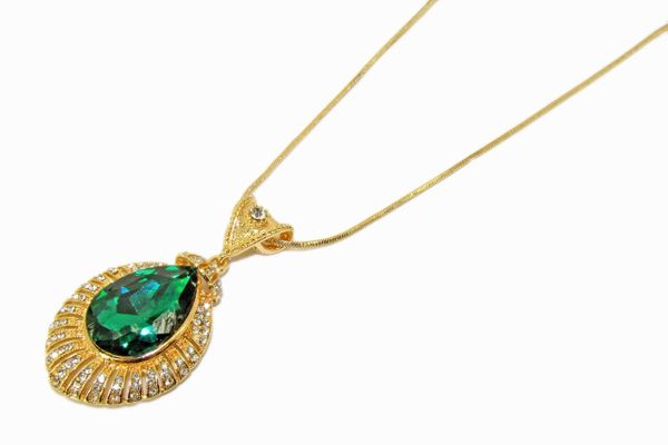 golden necklace pendant with emerald inset