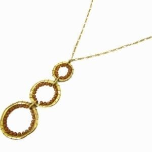 necklace pendant with a column of three golden hoops