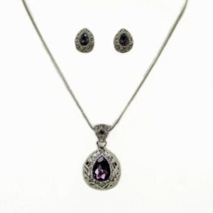 earrings and necklace with dark teardrop gemstone