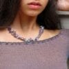 women wearing violet necklace and bracelet