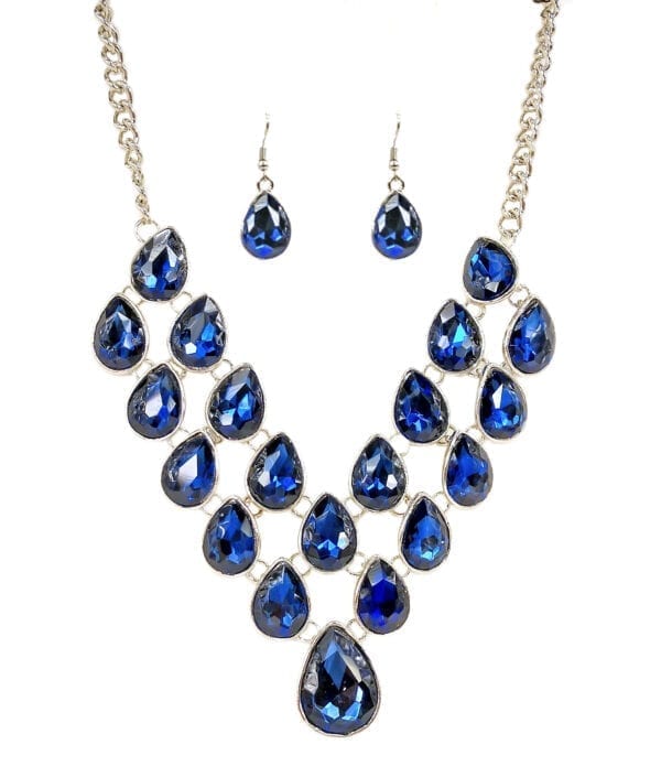 silver chain necklace with many blue teardrop sapphires