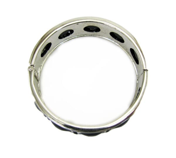 top view of a metal bracelet with animal print design