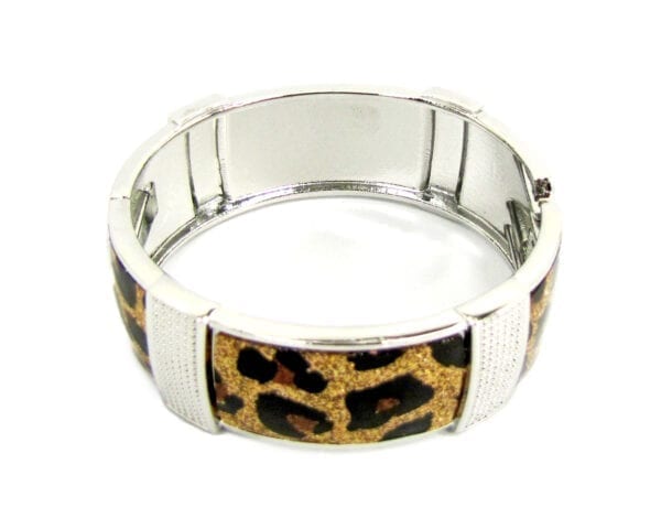 top view of a metal bracelet with animal print design