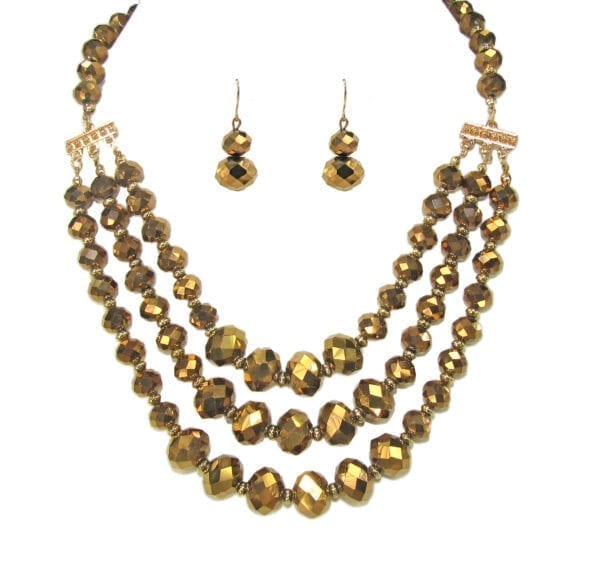 layered necklace and earrings with golden beadwork