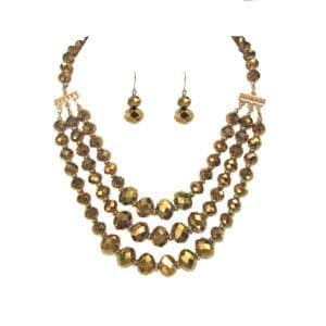 layered necklace and earrings with golden beads