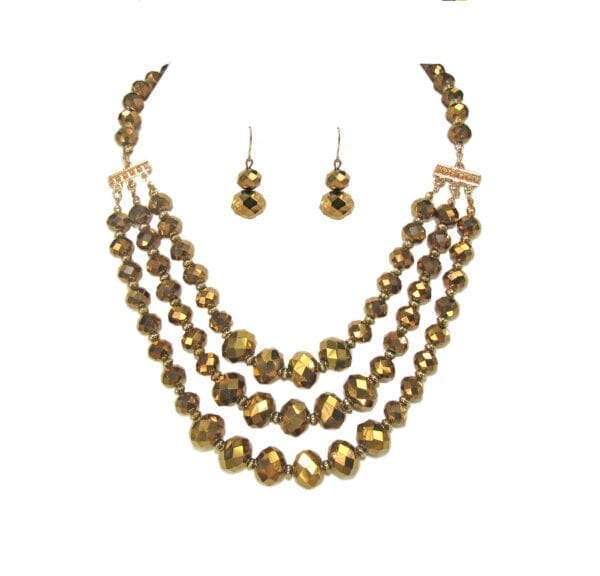 layered necklace and earrings with golden beads