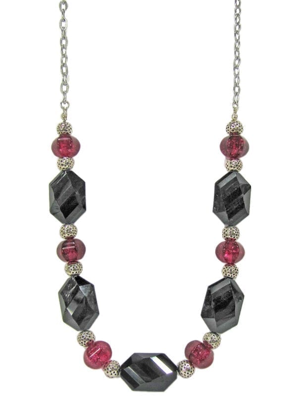 necklace with hexagonal black crystals and ruby gems