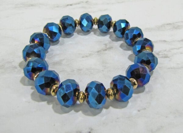 bracelet with blue crystal gems on a marble surface