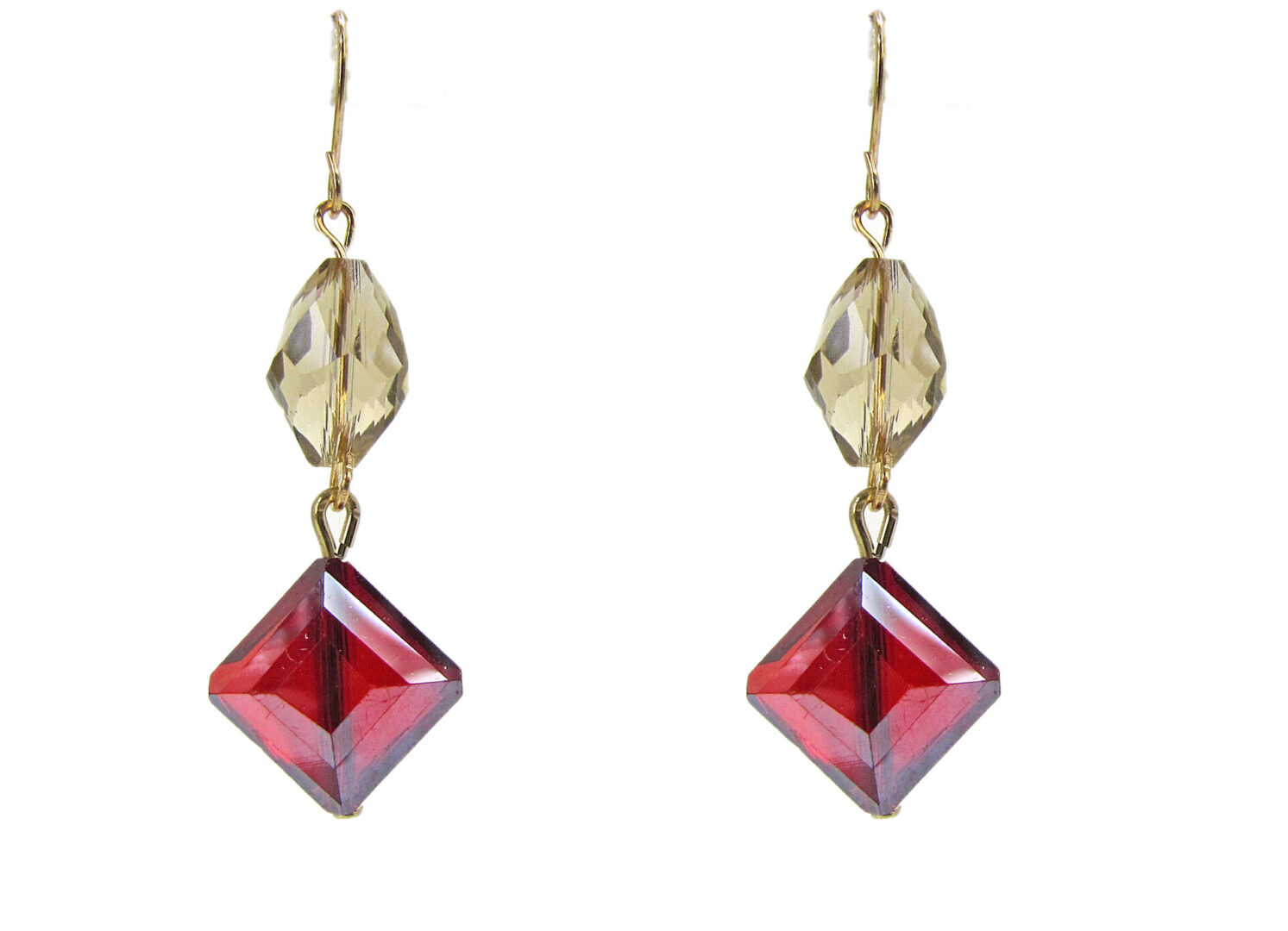 earrings with pale yellow and red gemstones