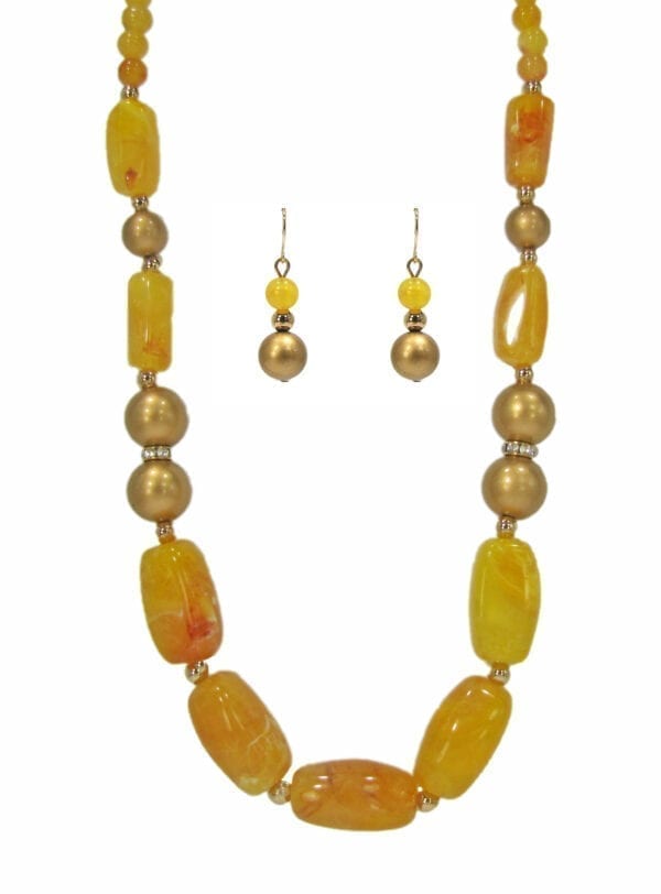 necklaces and earrings with dark yellow beads and gemstones