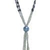 close up of a crystal necklace with large blue crystal pendant